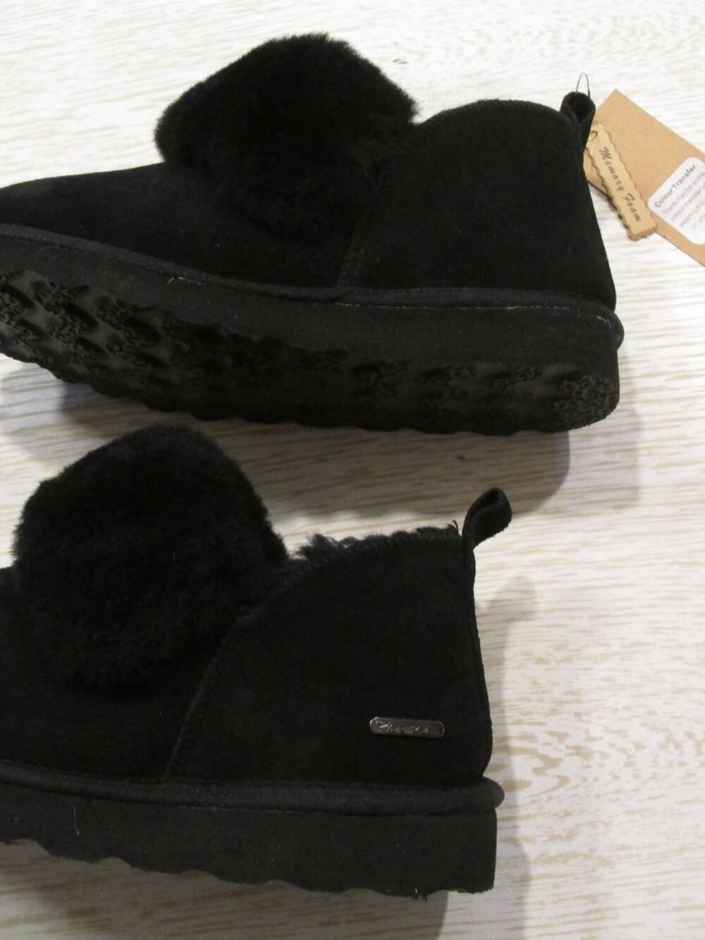 Slipper with a rigid sole